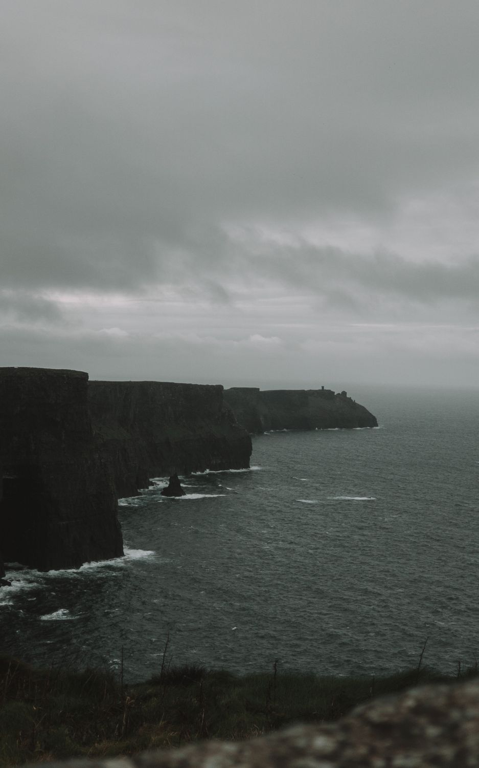 Over Cliffs A Gloomy Sky over the Cliffs by the Seaside · Free Stock Photo