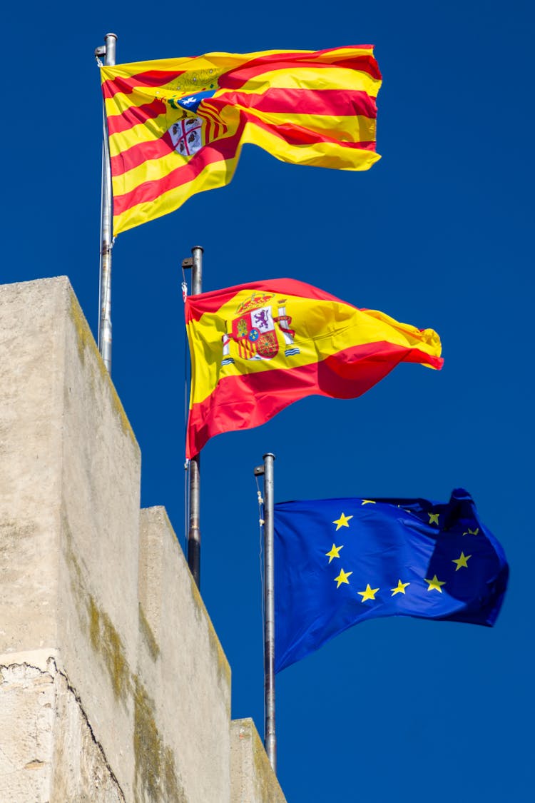 Low Angle Shot Of Waving Flags 