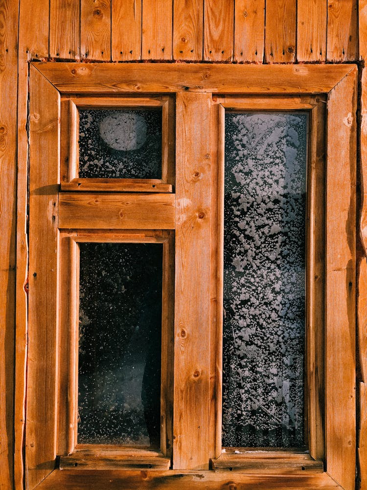 Frosty Glass Of A Wooden Window