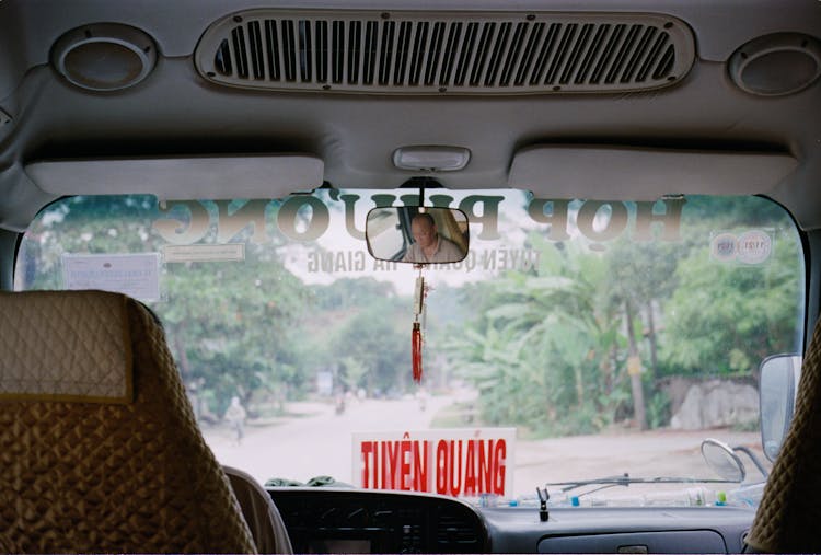 Man Reflection In Car Mirror