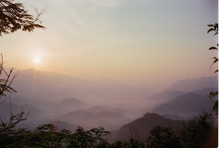 Sun Above Mountains On Foggy Sunrise