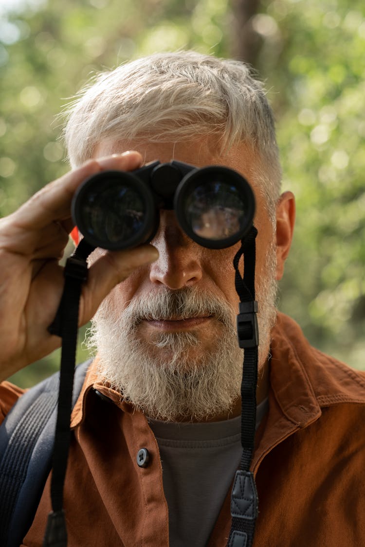 Elderly Man Looking Through Binoculars