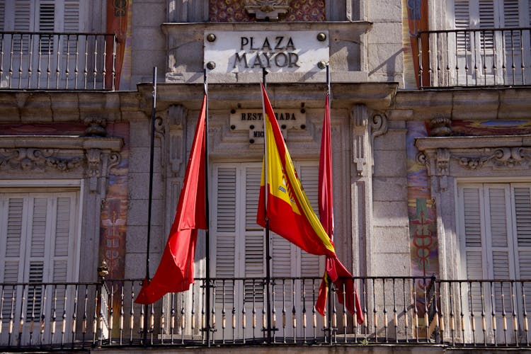 Flags At The Centro De Turismo Plaza Mayor