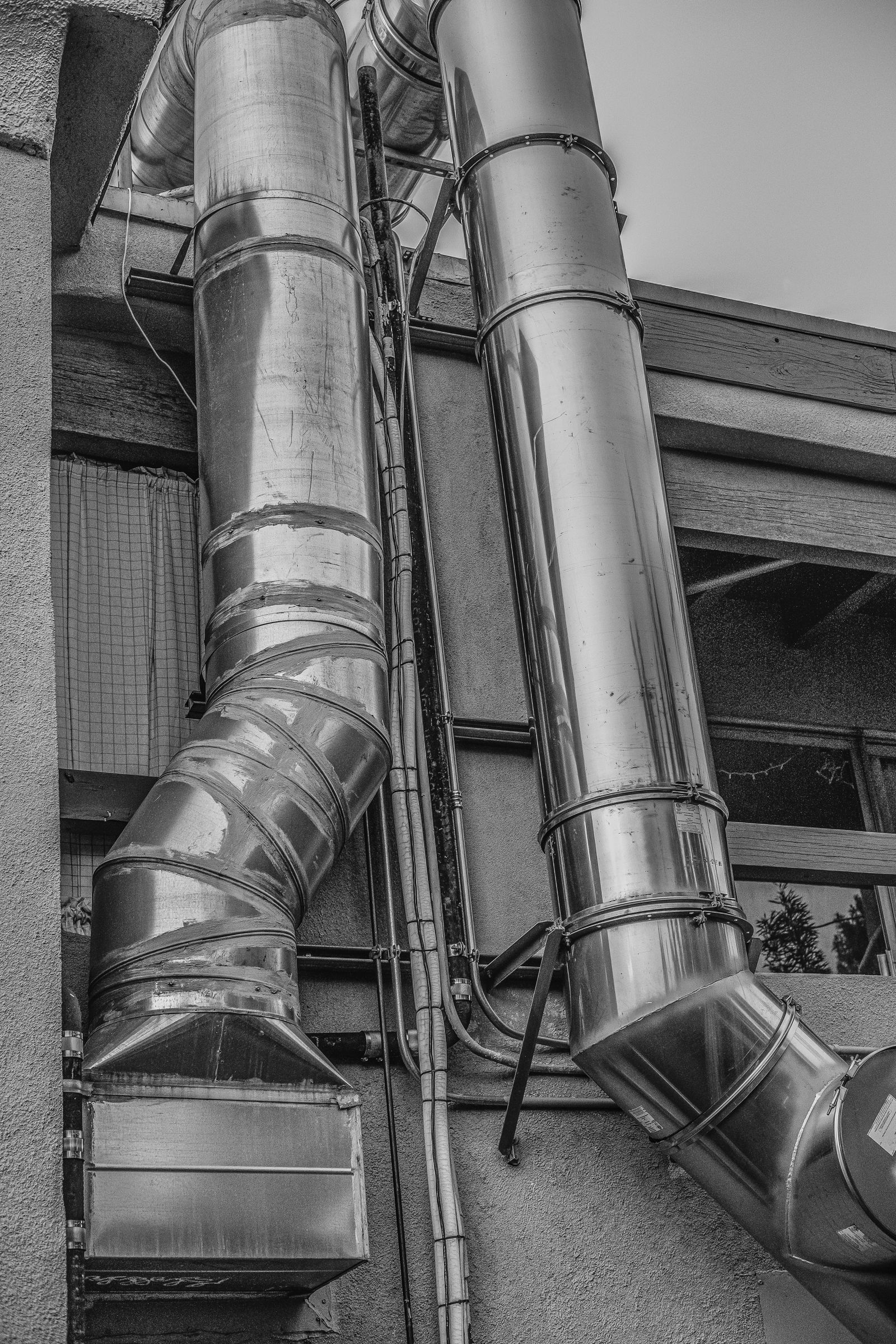 Independent commercial TAB firm — exterior HVAC ductwork on a multi-story building in metro Atlanta