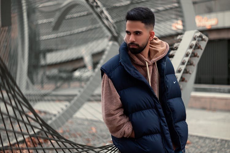 A Bearded Man In A Navy Blue Gilet