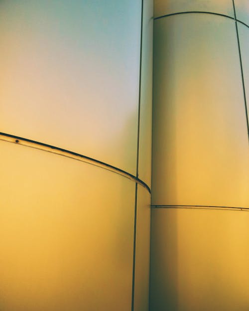 Yellow Light on Curved Steel Wall