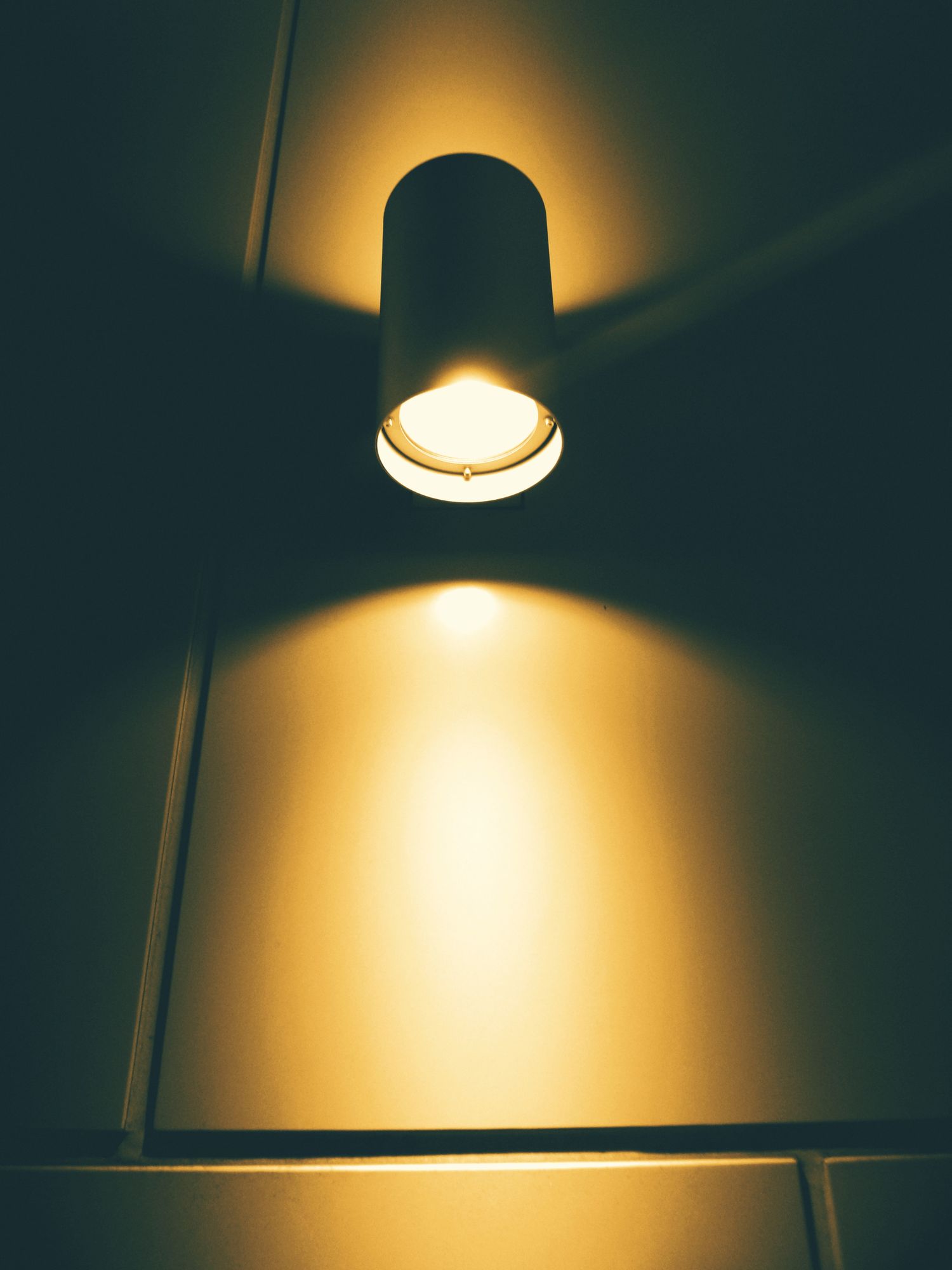 A warm light glowing on a dark wall