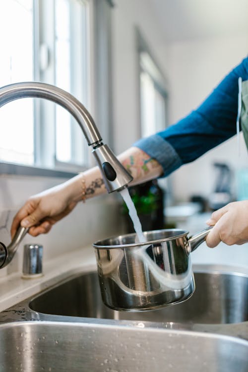 Free Tap Water Used while Cooking Stock Photo
