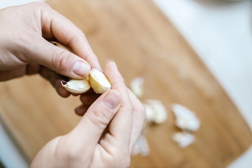 Free Hands Holding Garlic Stock Photo