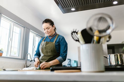 Woman Concentrated on Cooking