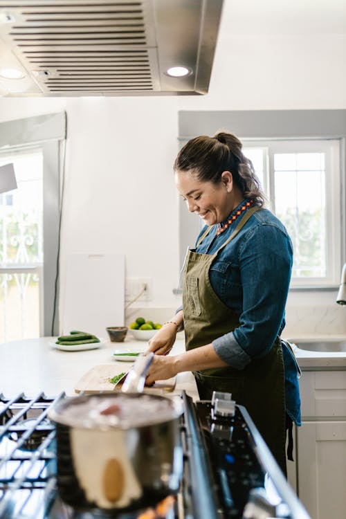 Woman Preparing Food in Kitchen · Free Stock Photo
