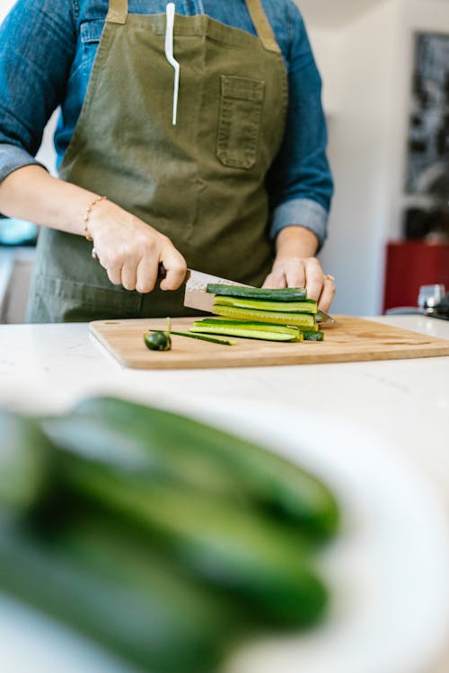 Woman Cutting Cucumber