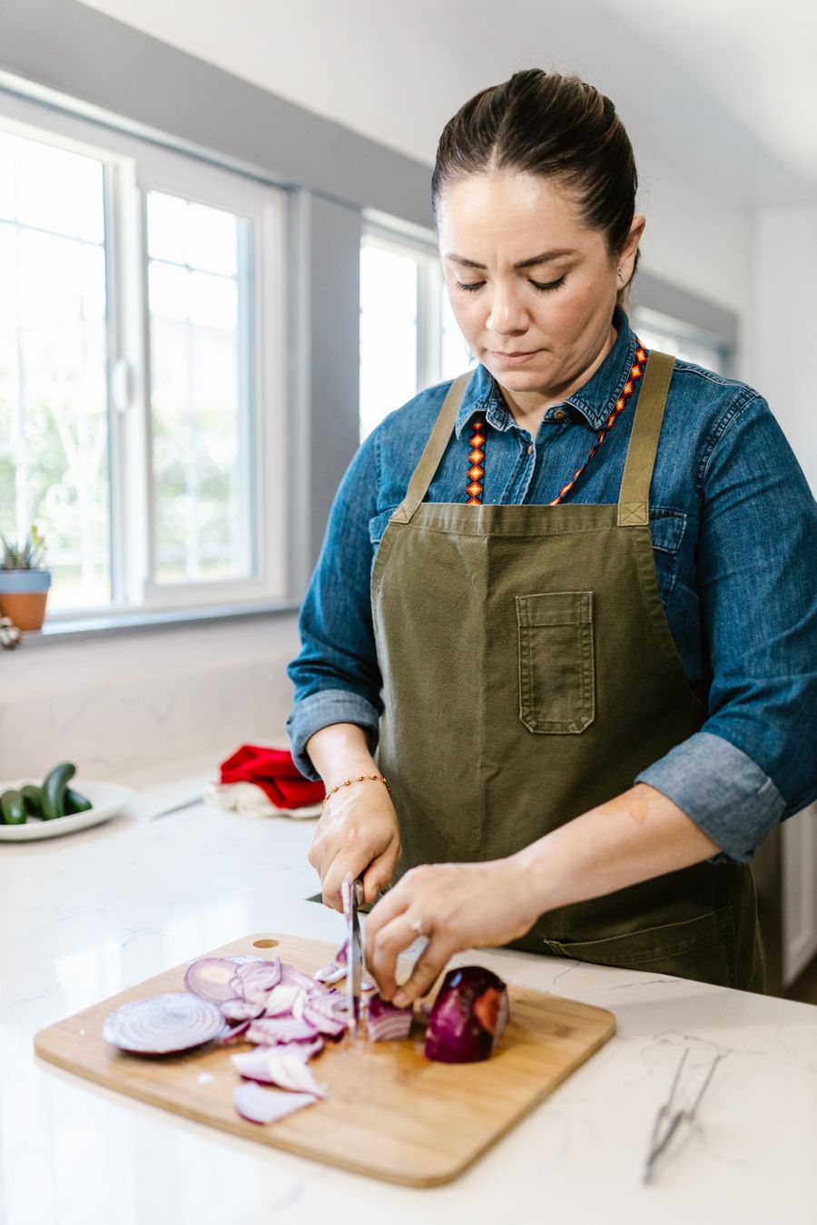 Fresh ingredients being prepared on a sunlit cutting board