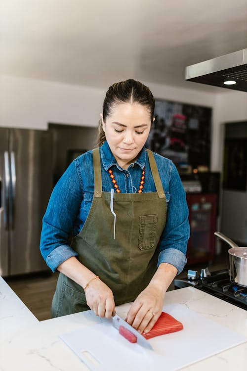 Woman Cutting Onion with Knife · Free Stock Photo