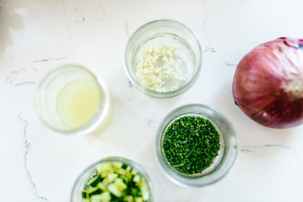 Fresh chopped ingredients and herbs arranged for cooking