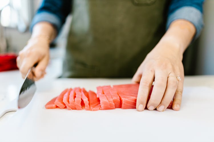 Cutting Fish Fillet In Close Up