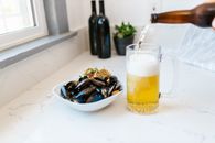 Clams and Scallops Served with Glass of Light Bear