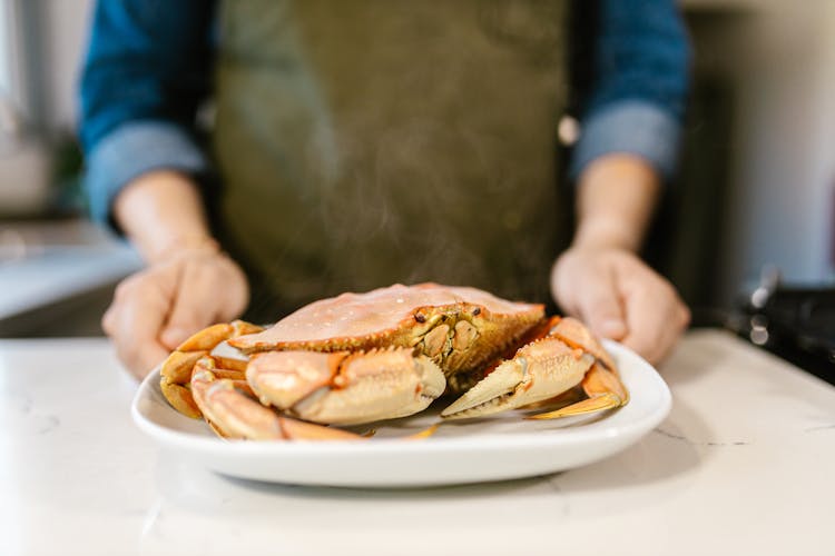 Crab Laying On Plate Presented By Chef