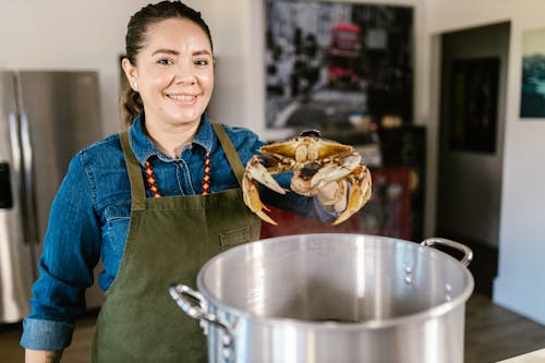 Free Woman Cooking Lobster Stock Photo