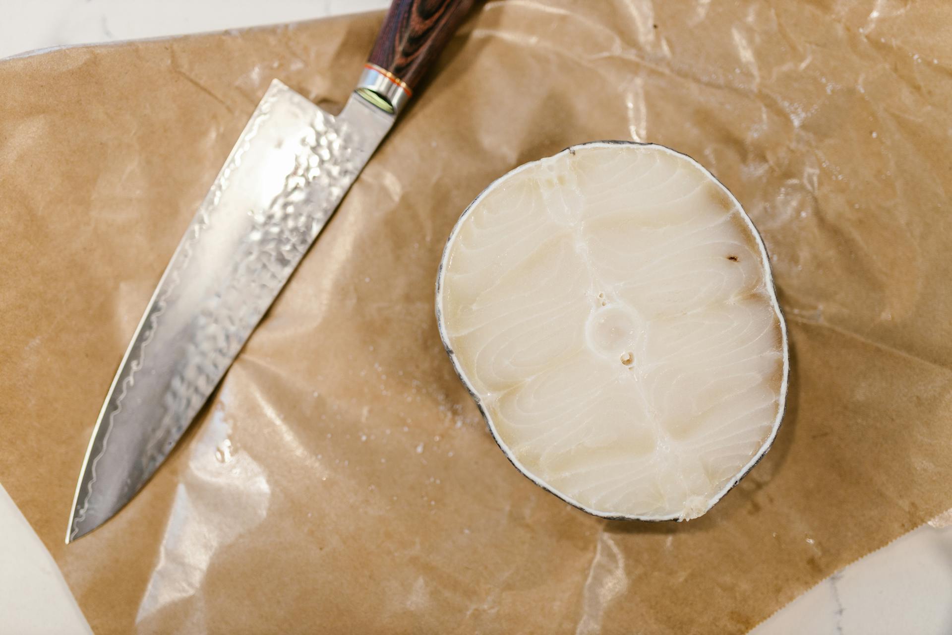 Food and Knife on Parchment Paper