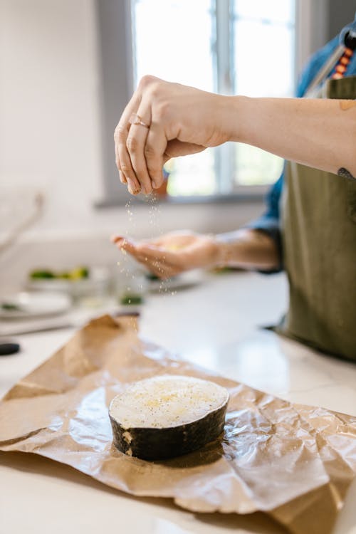 Preparing of Fish Slice Laying on Wrapping Paper for Cooking