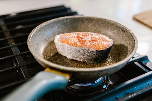 Close-up of Salmon Cooking in Frying Pan