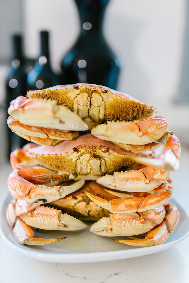 Crabs Stacked On White Plate