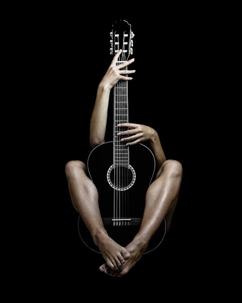 A Person Holding a Guitar