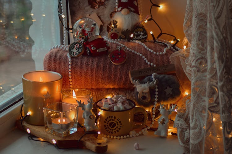 Assorted Christmas Items On The Window Sill