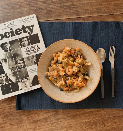 Pasta Dish on Brown Wooden Round Plate