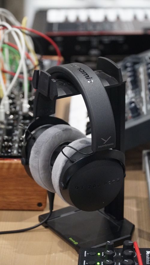 Free Close-up of headphones and audio equipment illustrating modern sound technology in a studio setting. Stock Photo