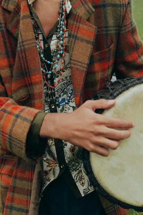 Free A Person Carrying a Djembe Drum Stock Photo