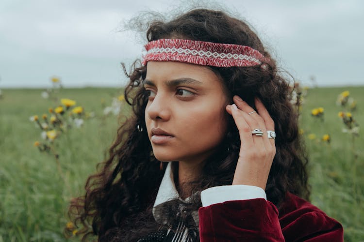 A Woman In Red And White Headband