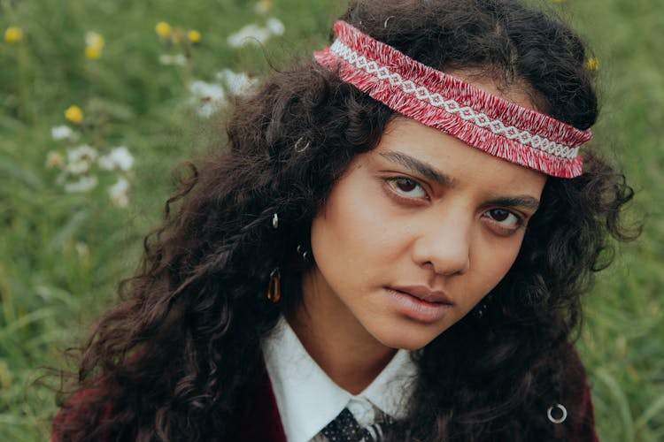 A Woman With Red And White Headband