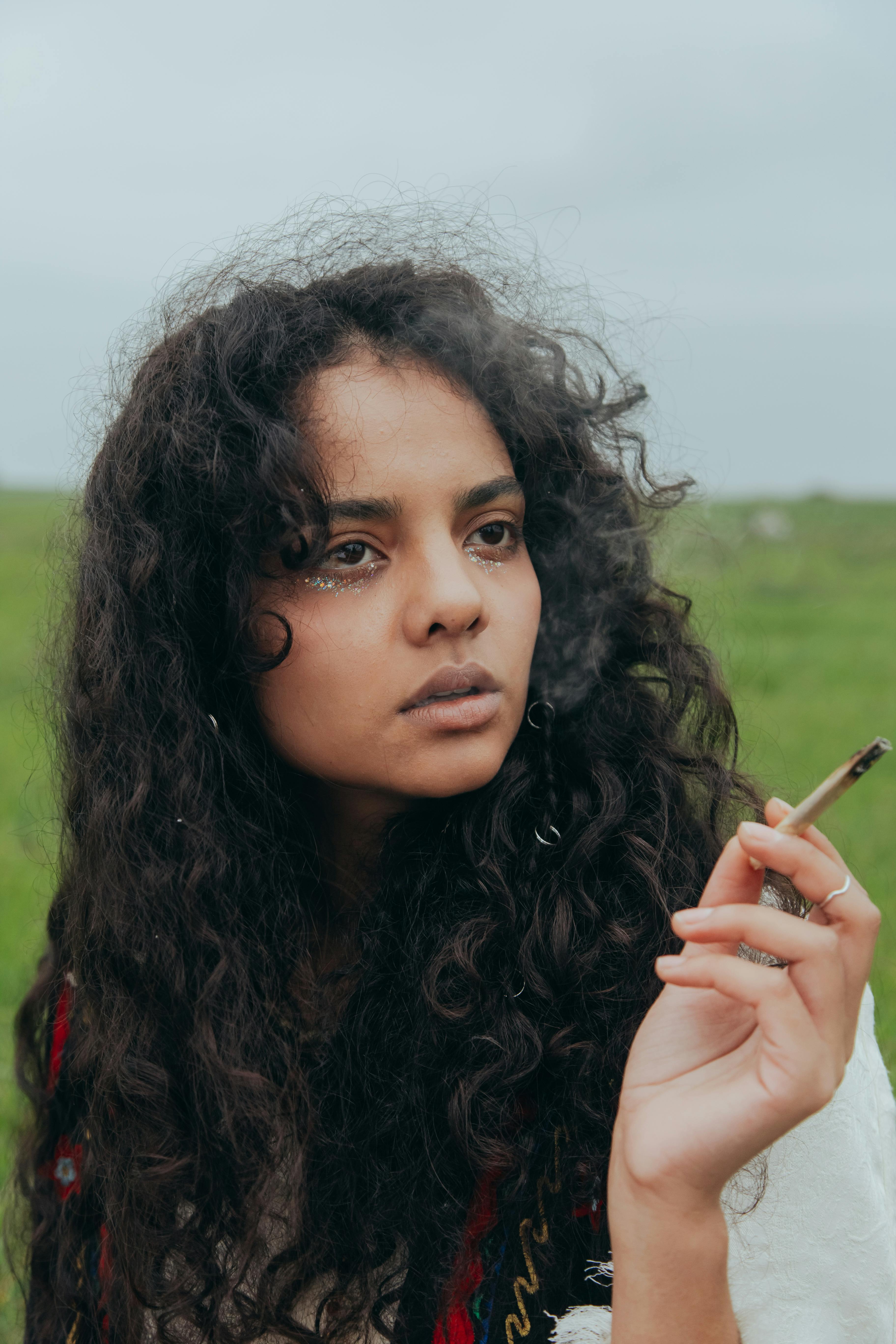 close up photo of woman smoking pot