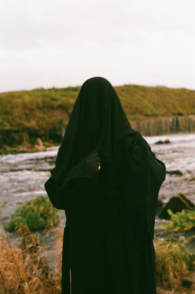 Woman In Black Abaya Near River