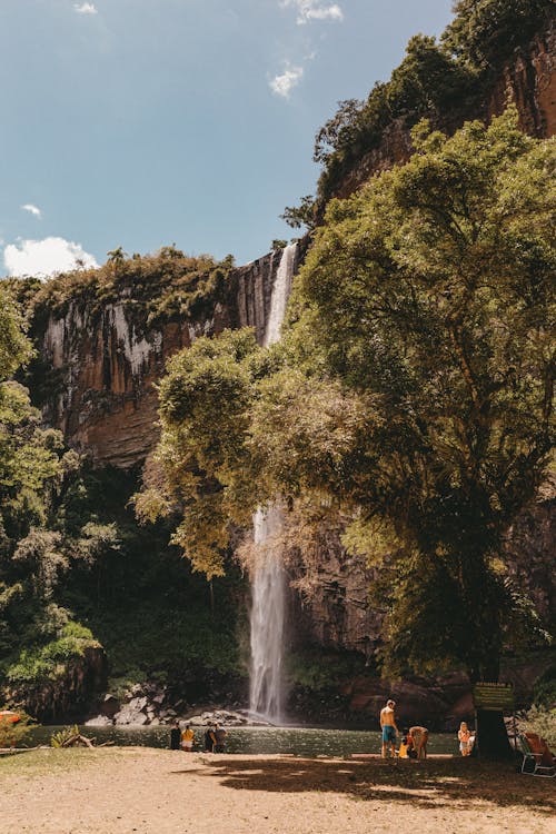 Free People Spending Their Vacation Near the Waterfalls Stock Photo