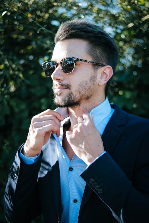 Man in Blue Dress Shirt and Black Formal Suit