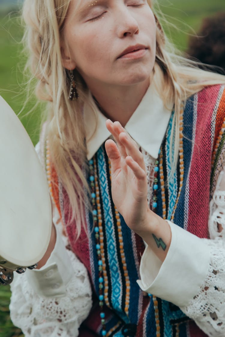 Blonde Woman Playing Tambourine