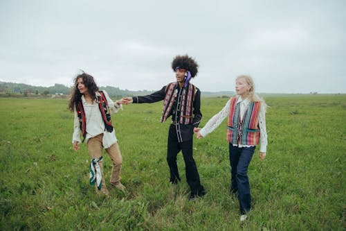 A Group of Hippies Holding Hands