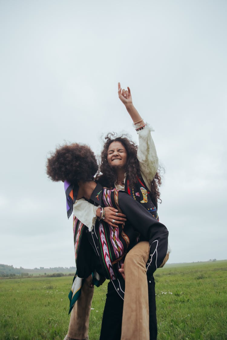 A Happy Woman Riding On Man's Back