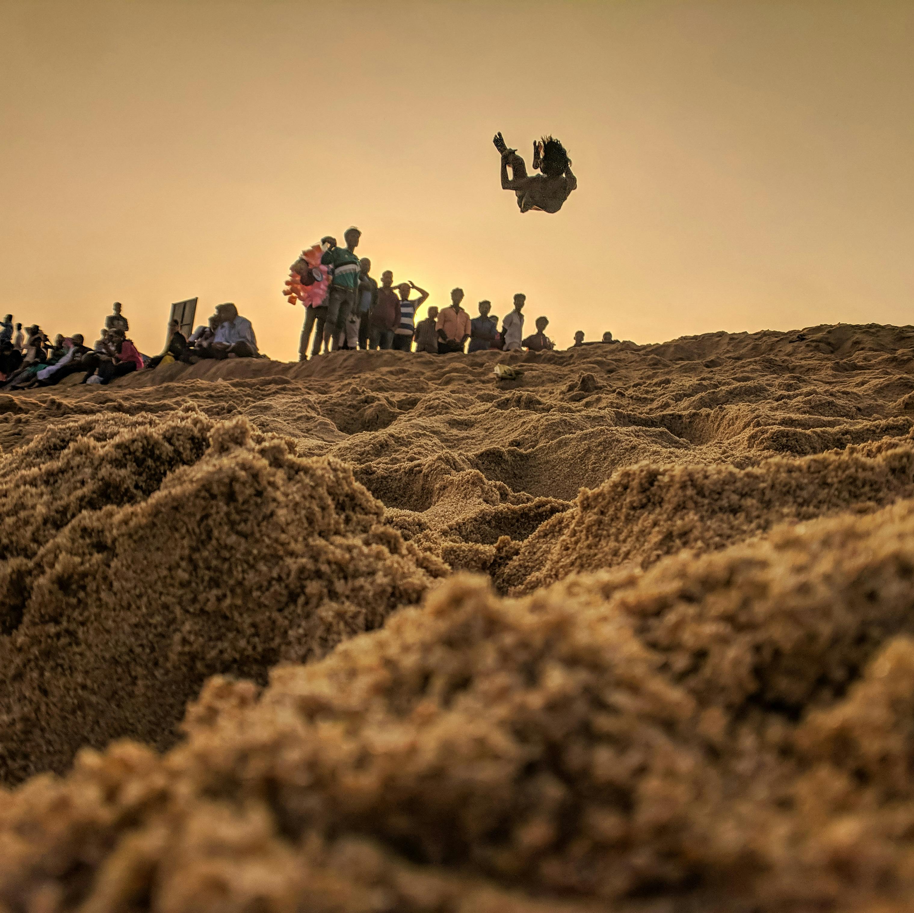 People Standing on Brown Sand · Free Stock Photo