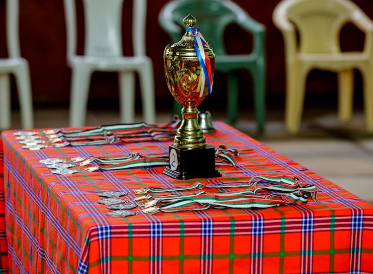 Gold Trophy And Medals On The Table