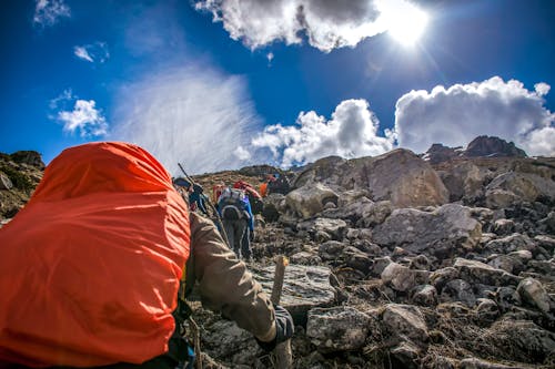 Free People Hiking on Mountain Stock Photo