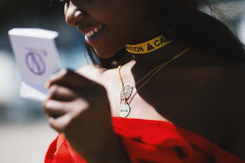 Woman in Red Strapless Dress in Macro Photography