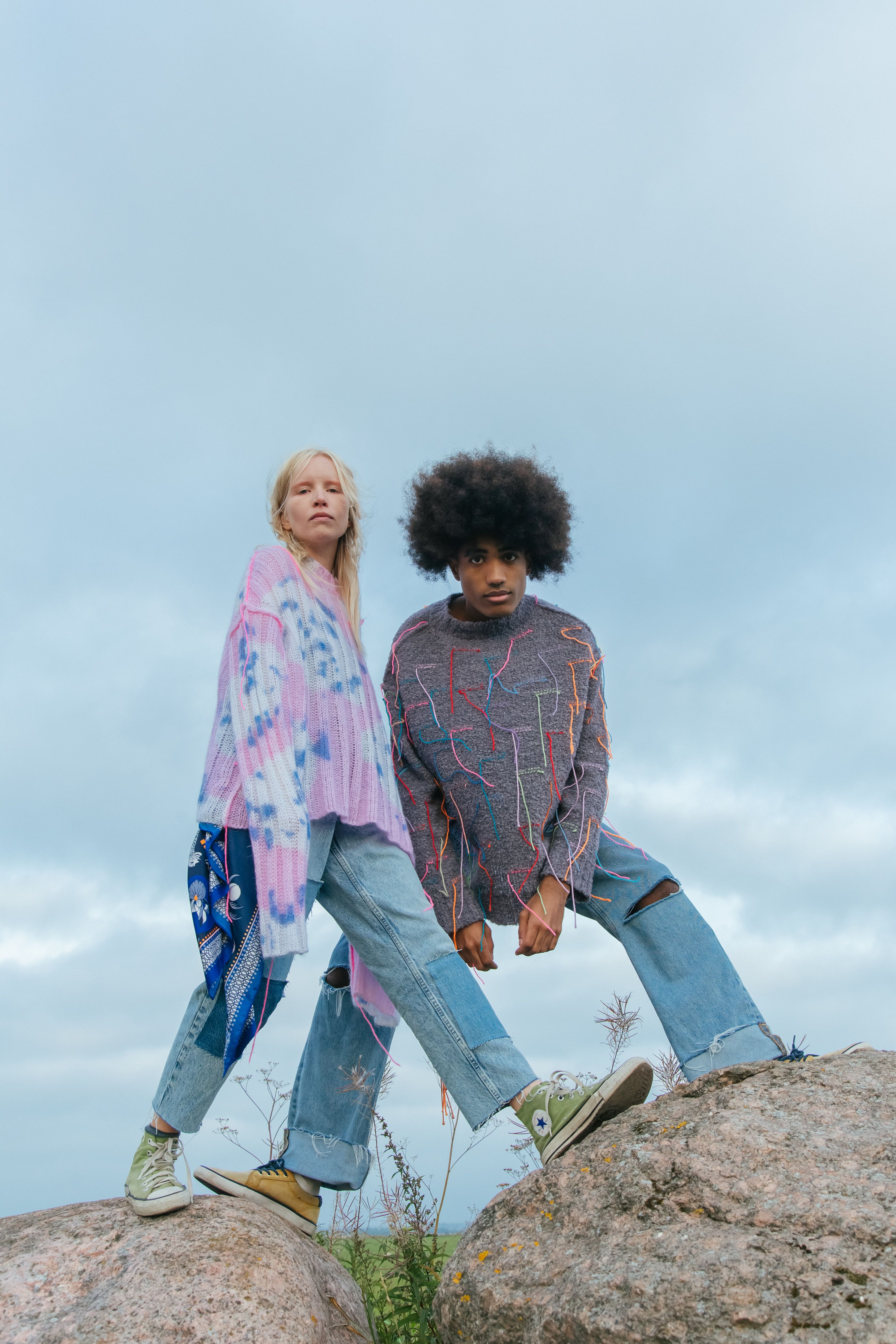 Man and Woman Standing on Big Rocks · Free Stock Photo