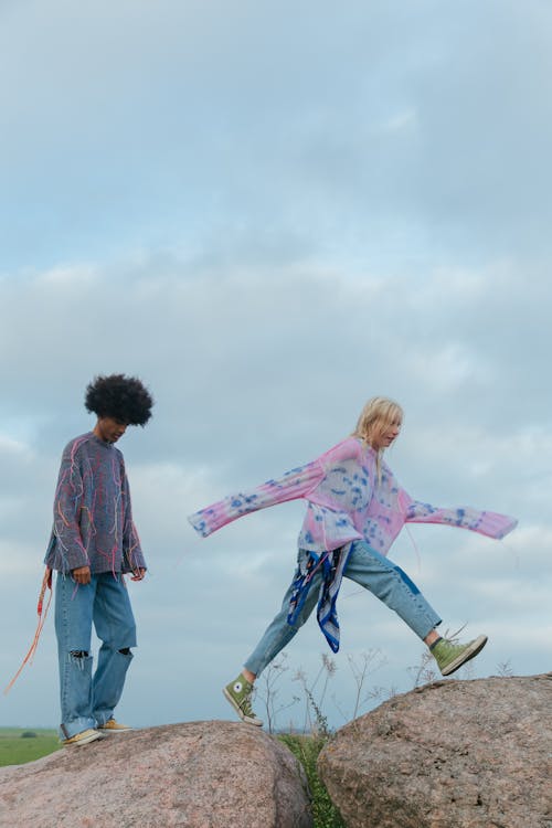 Couple Walking on Boulders