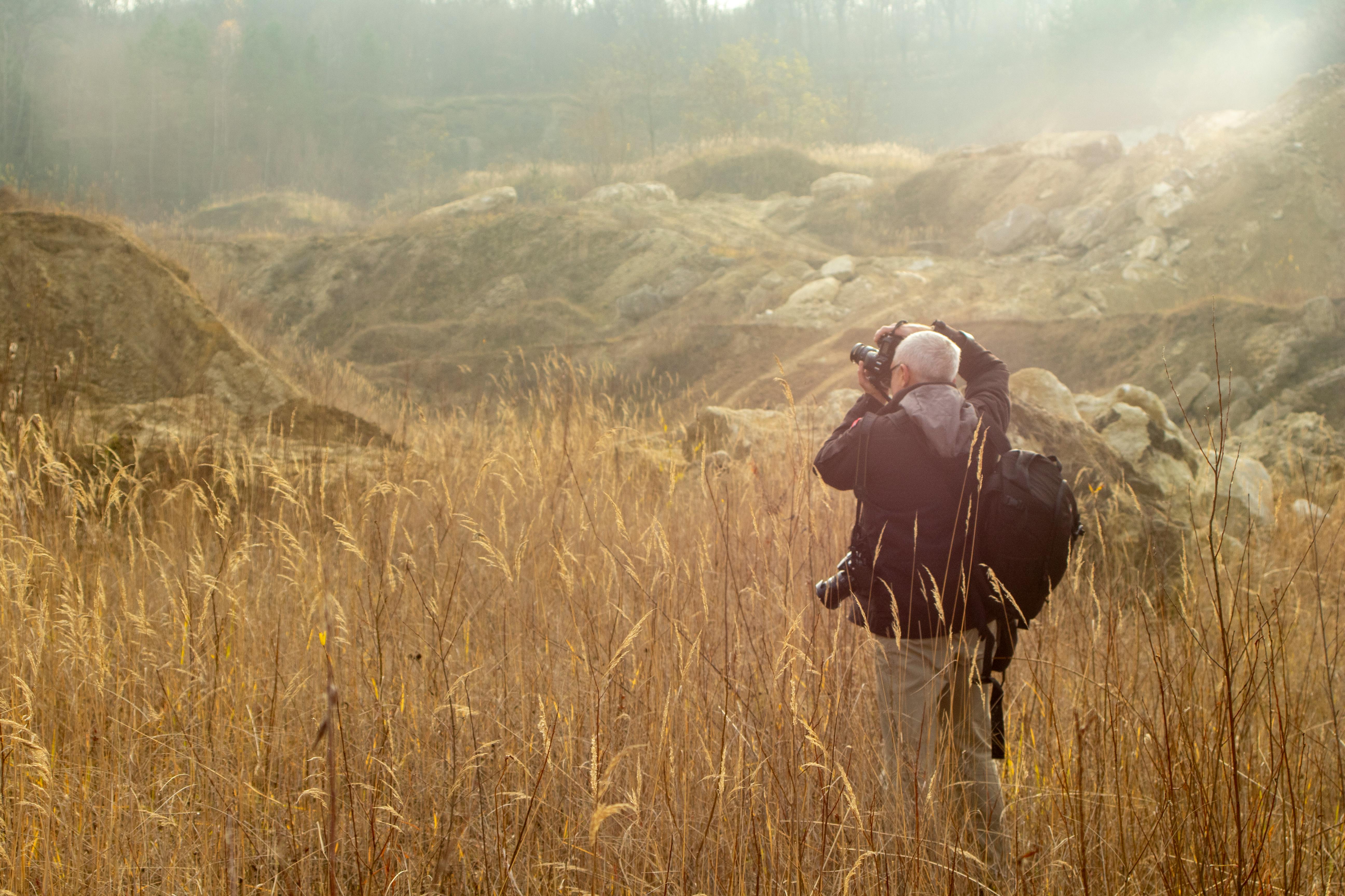 Beautiful Mountains In Fog And Standing Young Woman With Backpack