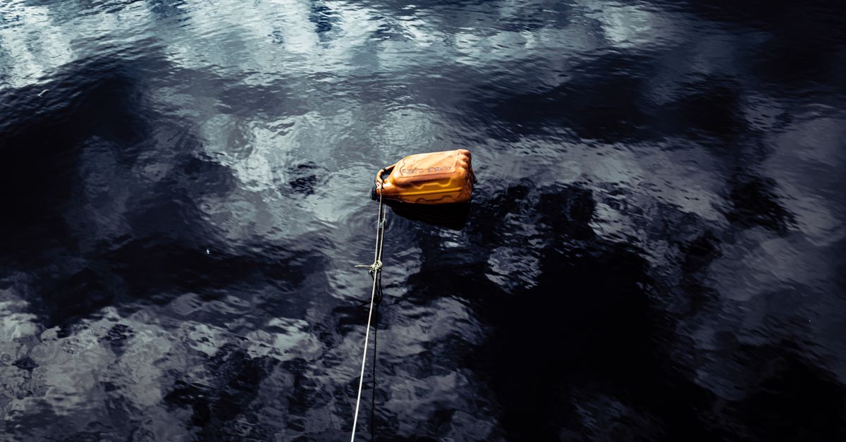 Container On Ropes Plastic Container on Rope in Water · Free Stock Photo