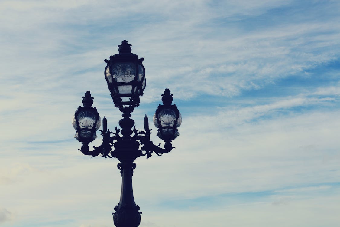 Black 3-in-1 Metal Post Under Blue and White Sky